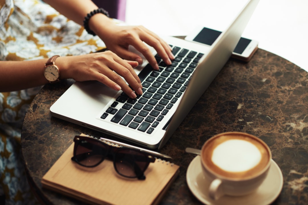Reading Acumatica cloud ERP guides on a laptop